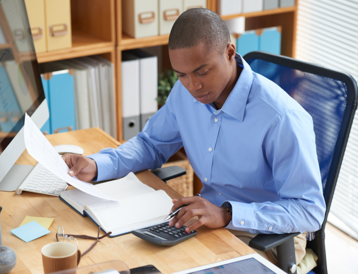 Accountant at work reviewing documents